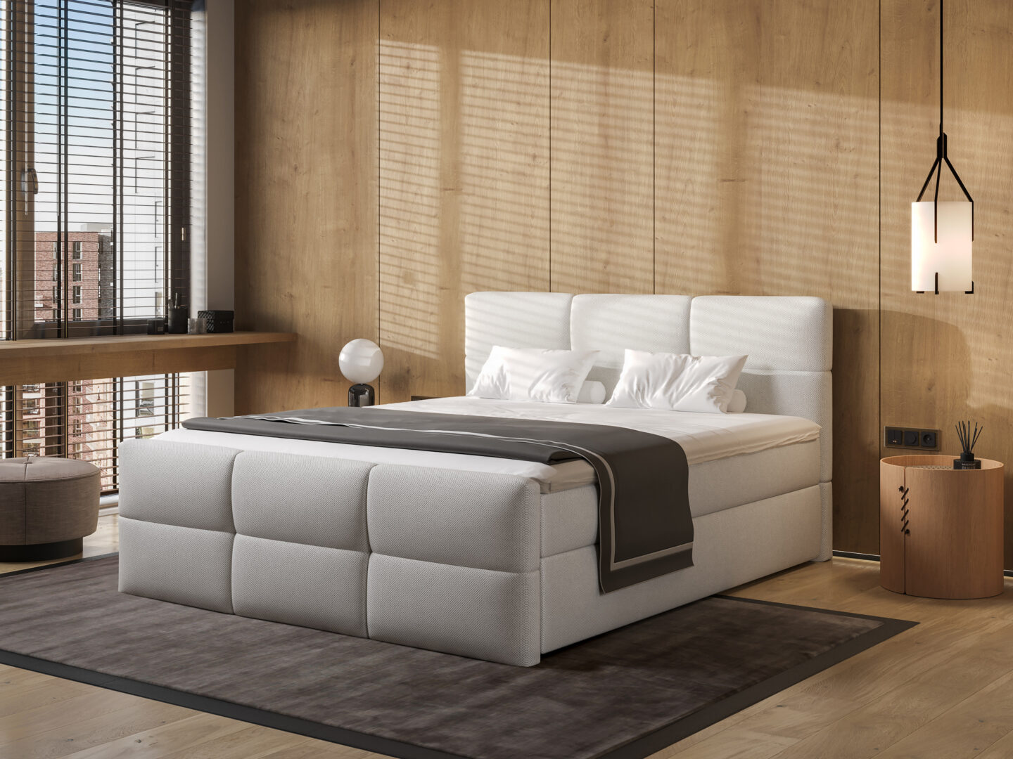 Lichtgrijze boxspring bed met wit beddengoed in moderne slaapkamer met houten wand en raam met jaloezieën Belga Meubel Brugge