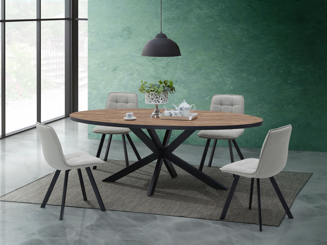 Moderne ovale eettafel met zwart metalen onderstel en beige stoffen stoelen op grijs tapijt in een interieur van Belga Meubel Brugge