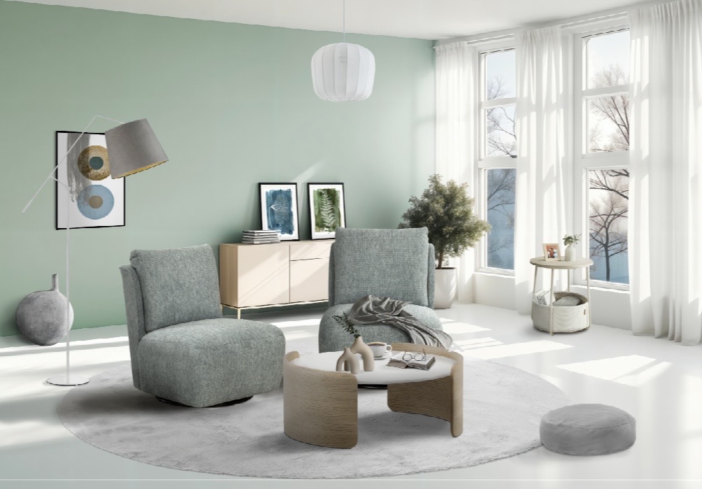 Modern woonkamerinterieur met twee comfortabele zetels, ronde salontafel en lichtgroene muur bij Belga Meubel Brugge
